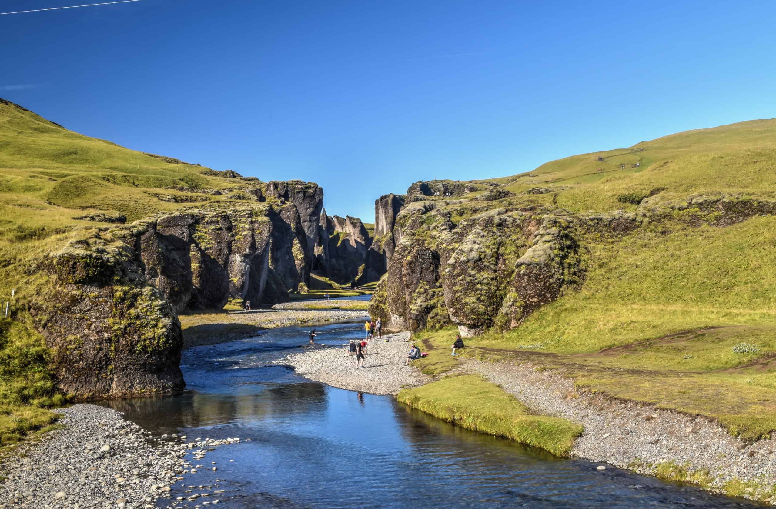 Fjaðrárgljúfur canyon iceland river people