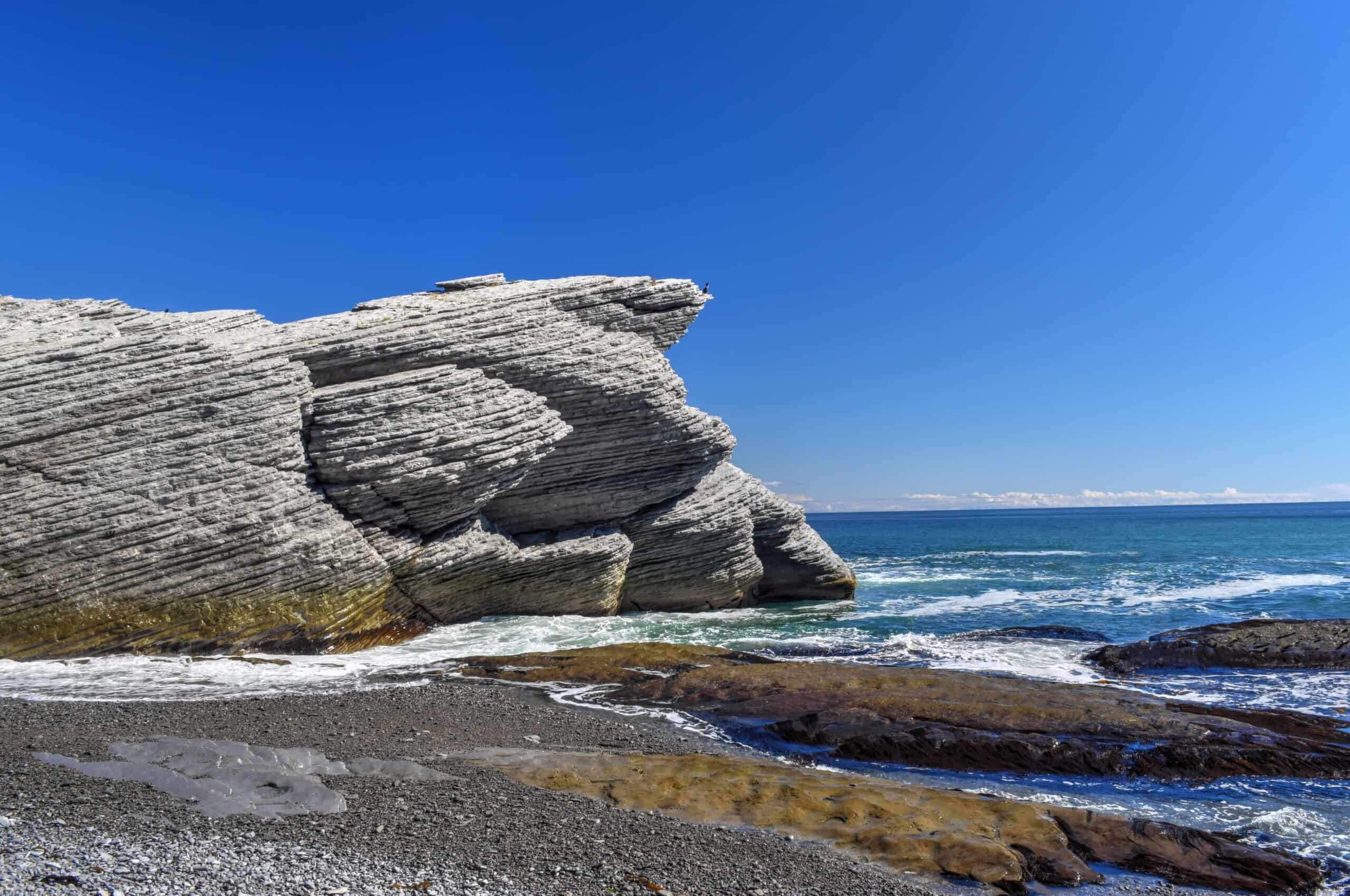 rocks and beach in cap bon ami forillon national park beach