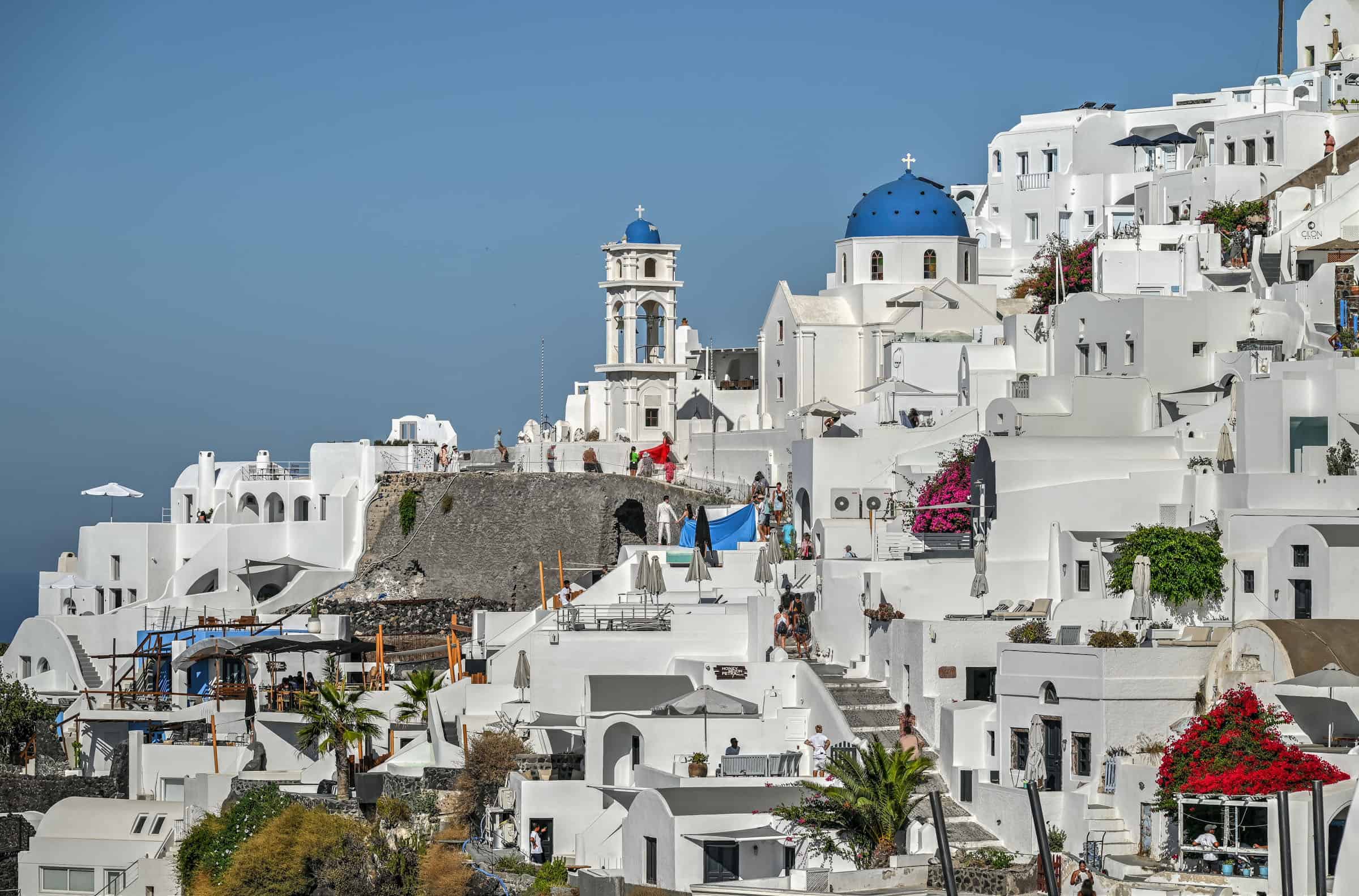 imerovigli fira walk on santorini, views of caldera and flying dress