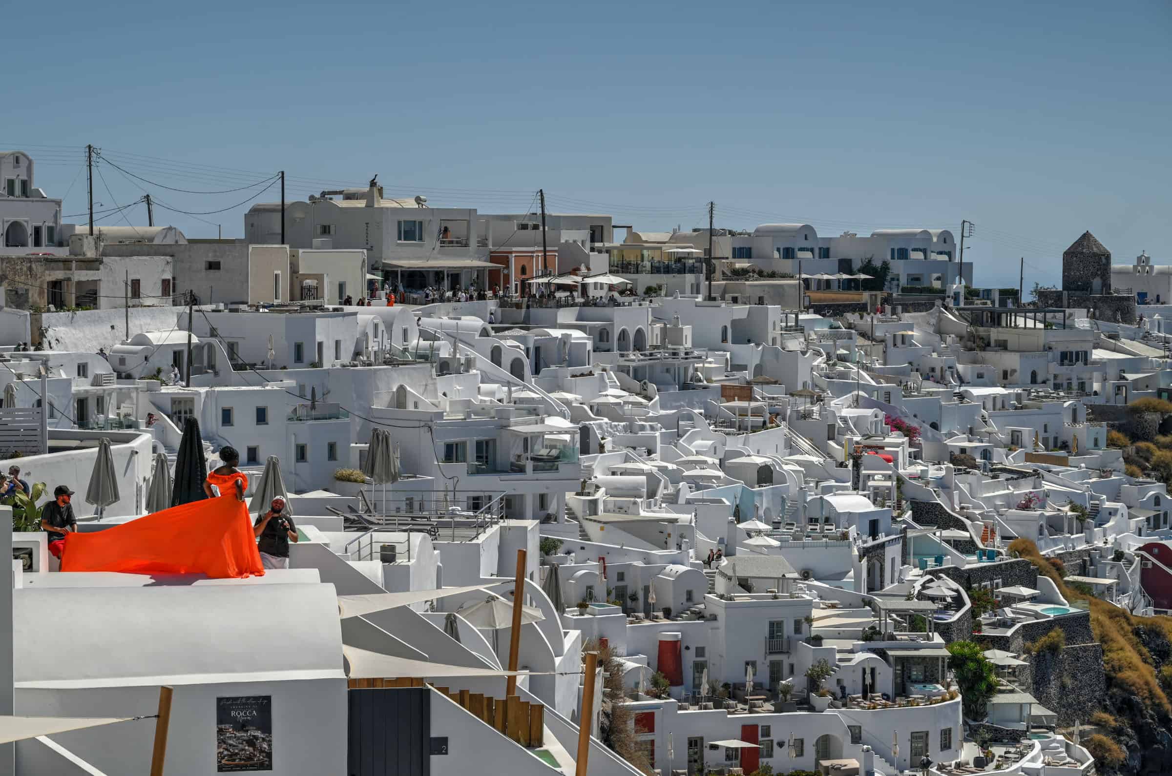 imerovigli fira walk on santorini, views of caldera and flying dress