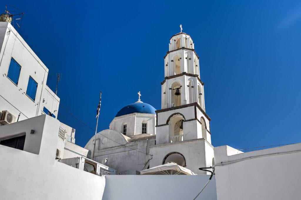 blue dome church tower and bells in pyrgos santorini