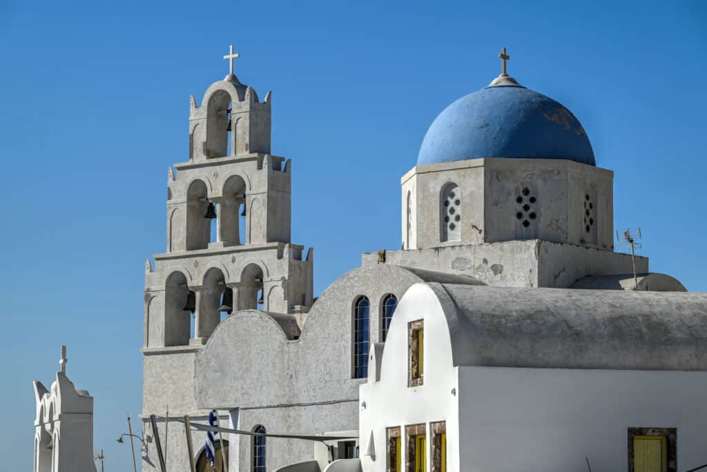 blue dome church and bells in pyrgos santorini