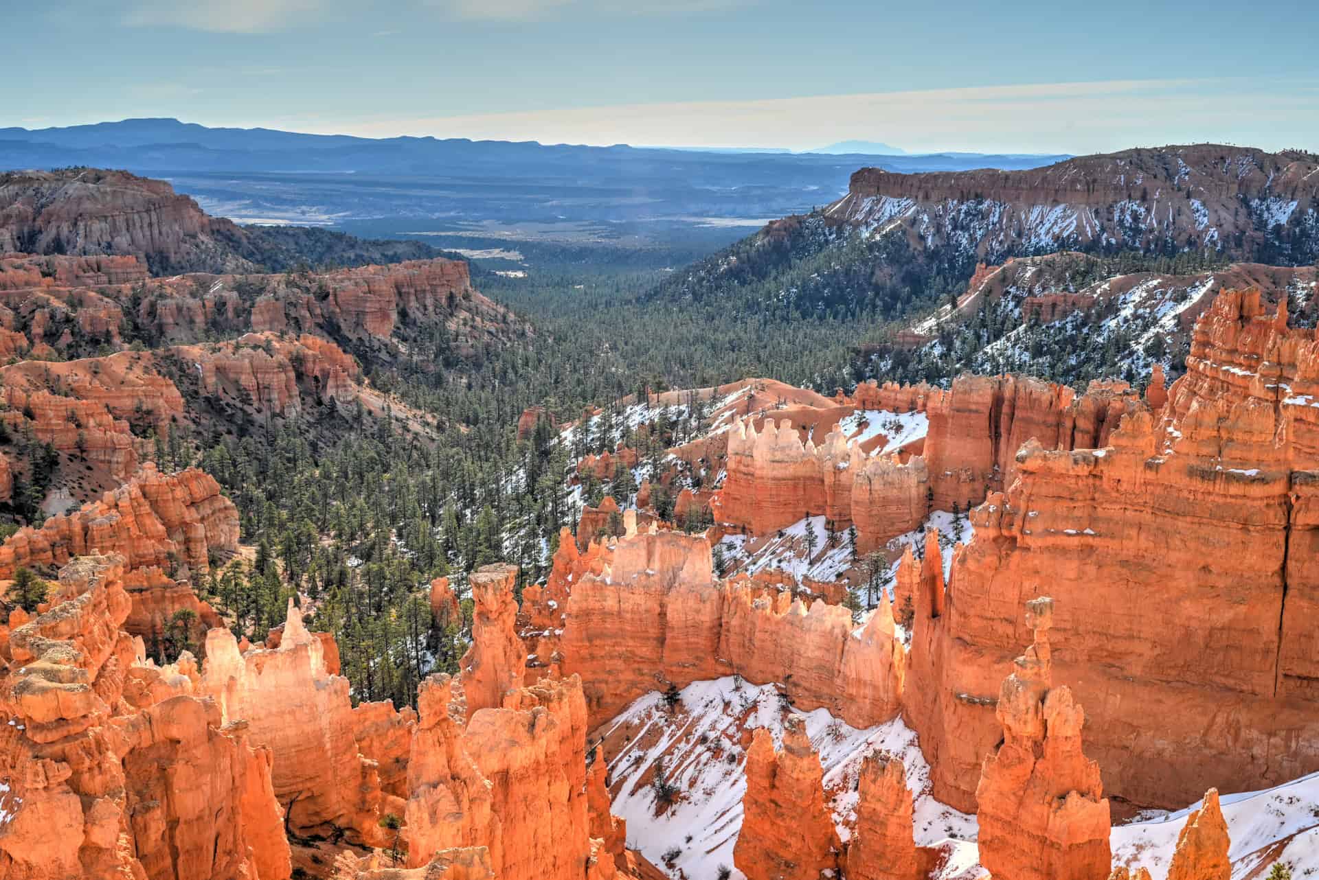 snow-capped hoodoos seen from sunset point